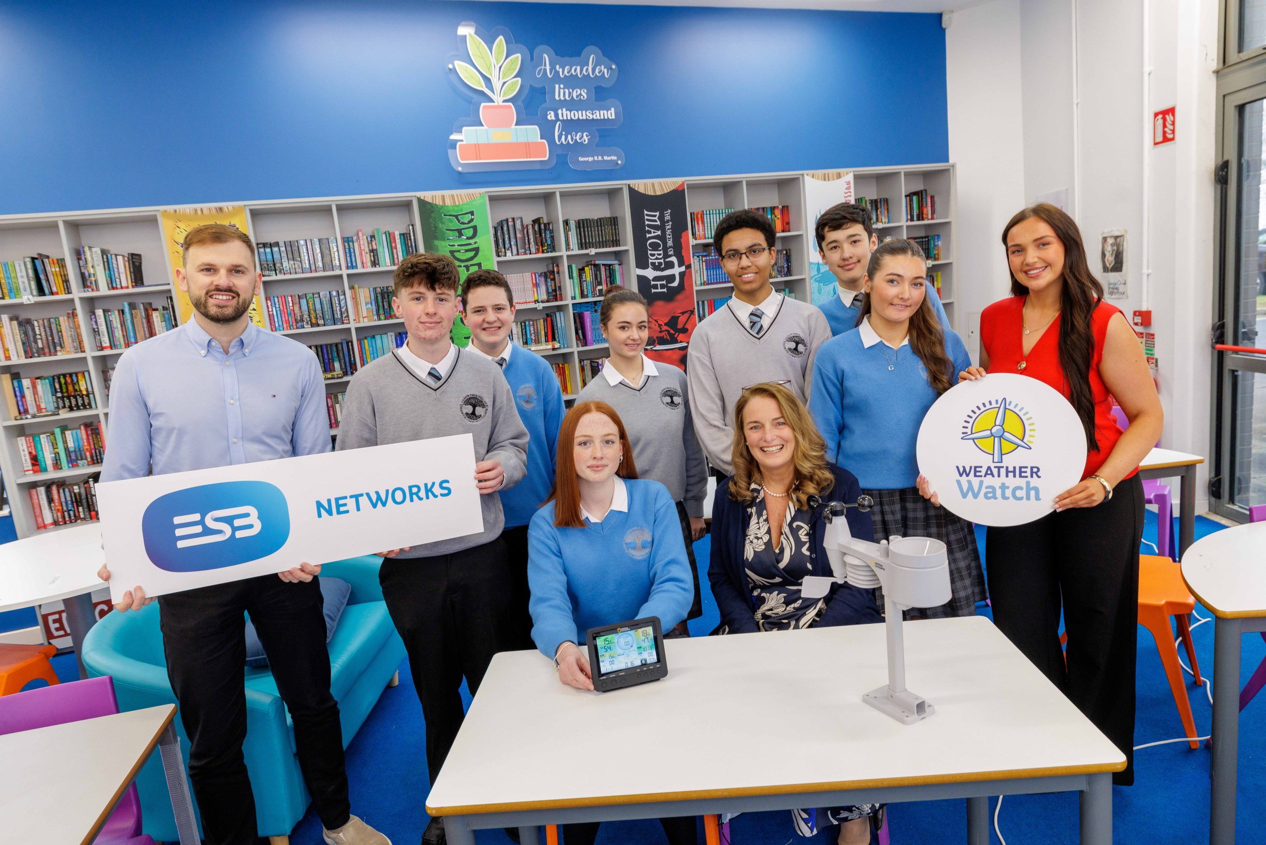 studentsand teachers holding props